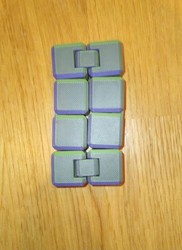 "A compact infinity cube with interlocking sections. It offers endless motion and satisfying flips."