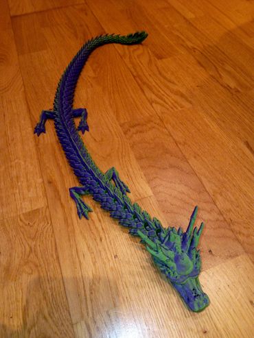 this is a purple and green dragon that you will love as soon as you have it.