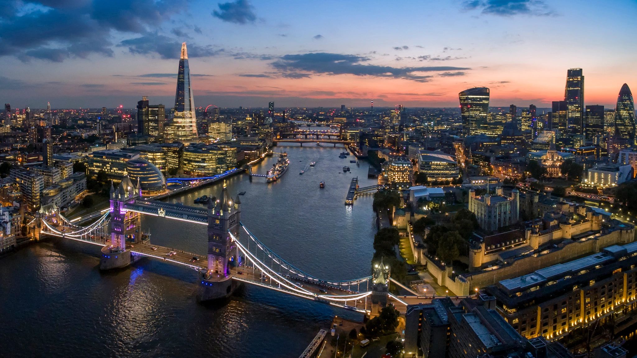 London skyline at dusk with Tower Bridge and the Shard. Tower Bridge is a short 4 min walk from 123 Minories