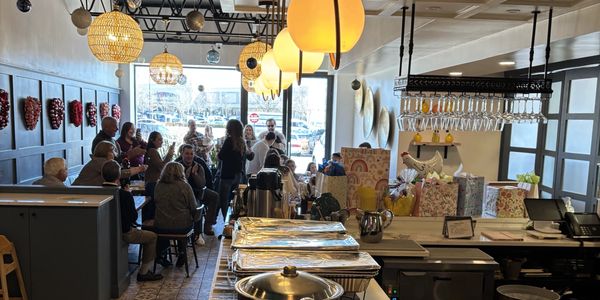 Citrus Wine Bar hosting a professional networking event with guests connectin and socializing.