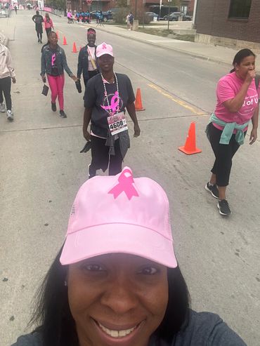 People participating in a breast cancer awareness walk.