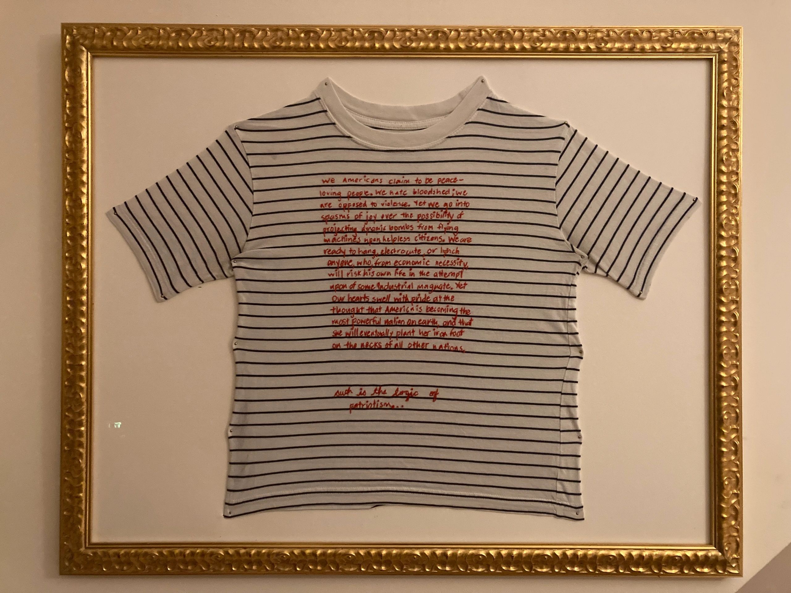 Hand embroidered shirt with Emma Goldman quote.