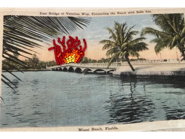 Beaded embroidery of bridge on fire