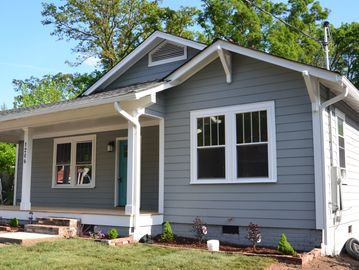 Exterior renovation on a early 1900s new home, with new windows 