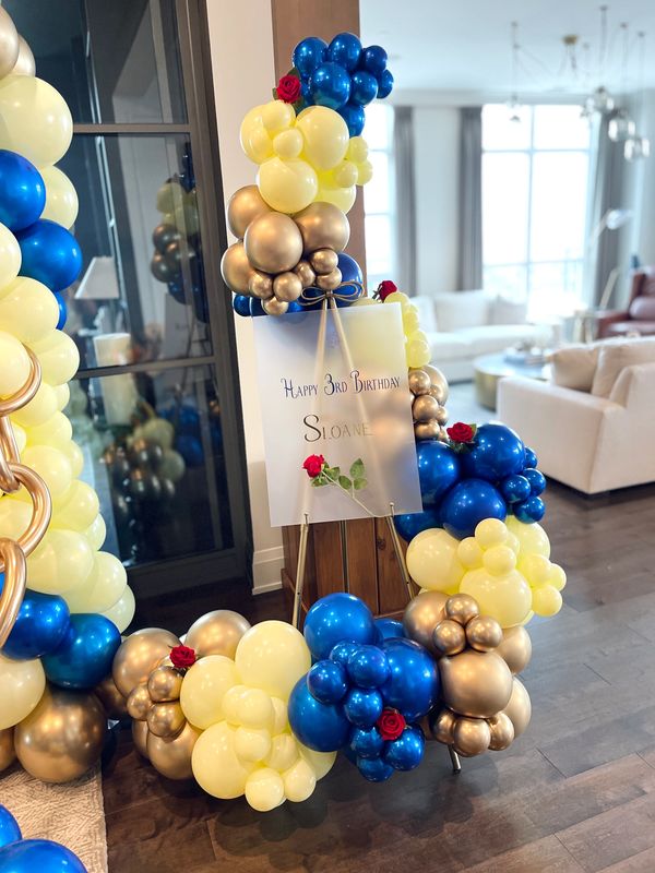 Beauty and the Beast themed birthday party with a beautiful welcome sign display. 