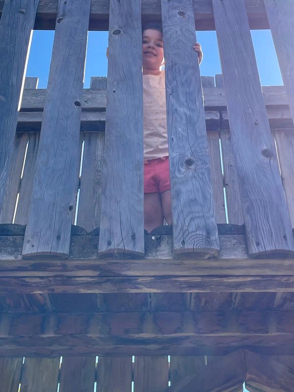 Child playing on climbing frame