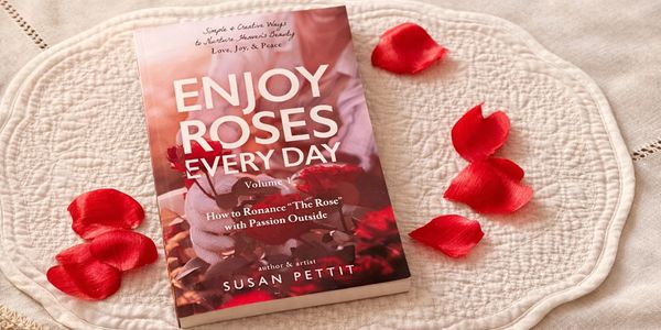 A book titled 'Enjoy Roses Every Day' surrounded by red rose petals.