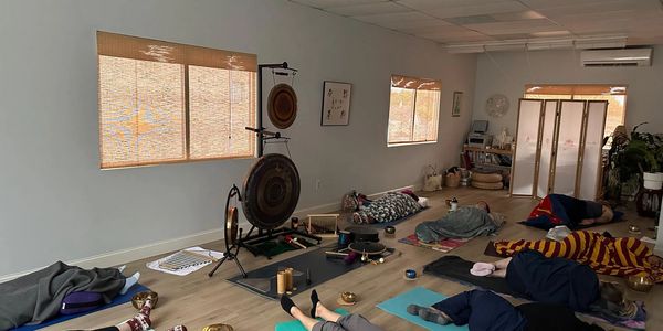 Group of people resting during a sound bath meditaiton
