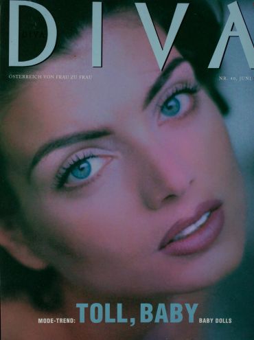 Close-up of a woman with blue eyes on a magazine cover.