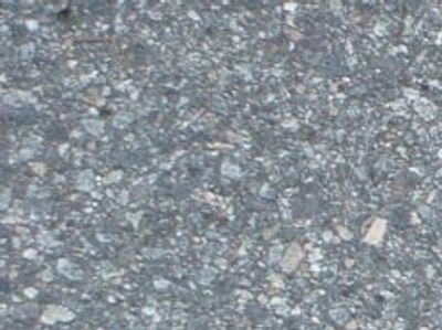Crack routing and hot-pour filling on busy DFW commercial driveway – DFW Striping and Sealcoating LL