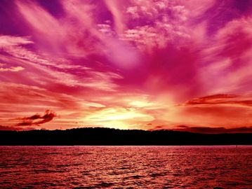 A pink and orange sunset over the sea