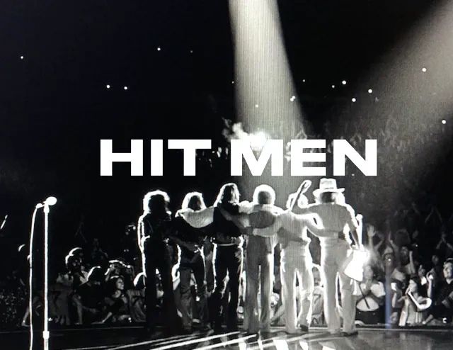 Stack of books next to pencils in a holder and a camera.