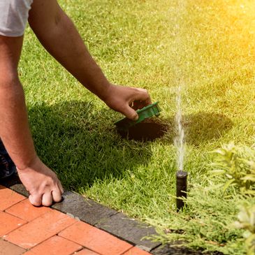 Man repairing irrigation system