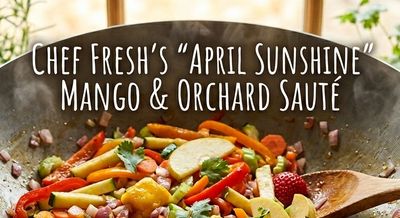 Colorful mango and orchard fruit sauté with vegetables in a wok.