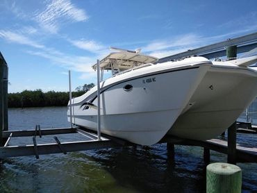 The Salty Beast showing off her twin hull design on the boat lift.
