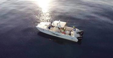 Views of "The Salty Beast" with passangers on board fishing in the gulf of mexico on a charter trip