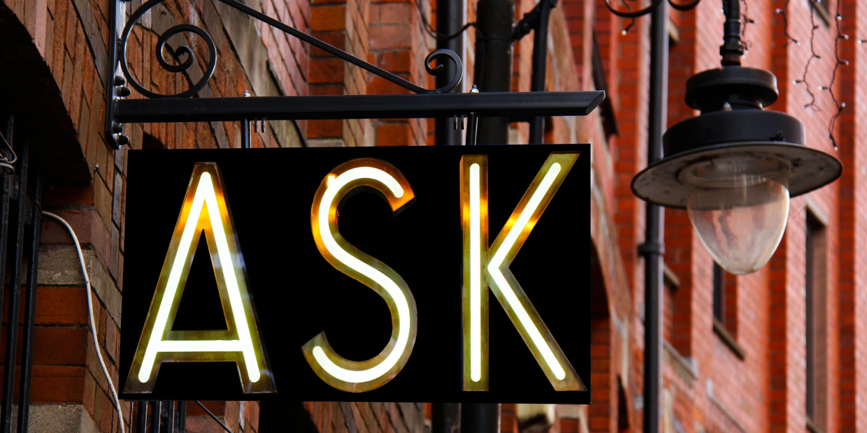 Ask sign outside red brick building