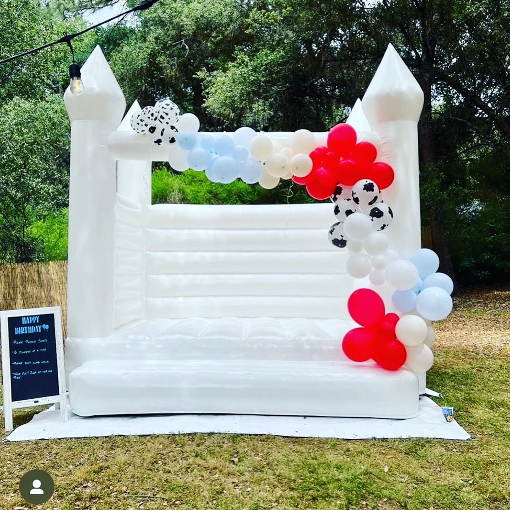 White bounce house on white tarp, 12x10x12. Free set up and delivery within 30 miles of Auburn, CA. 