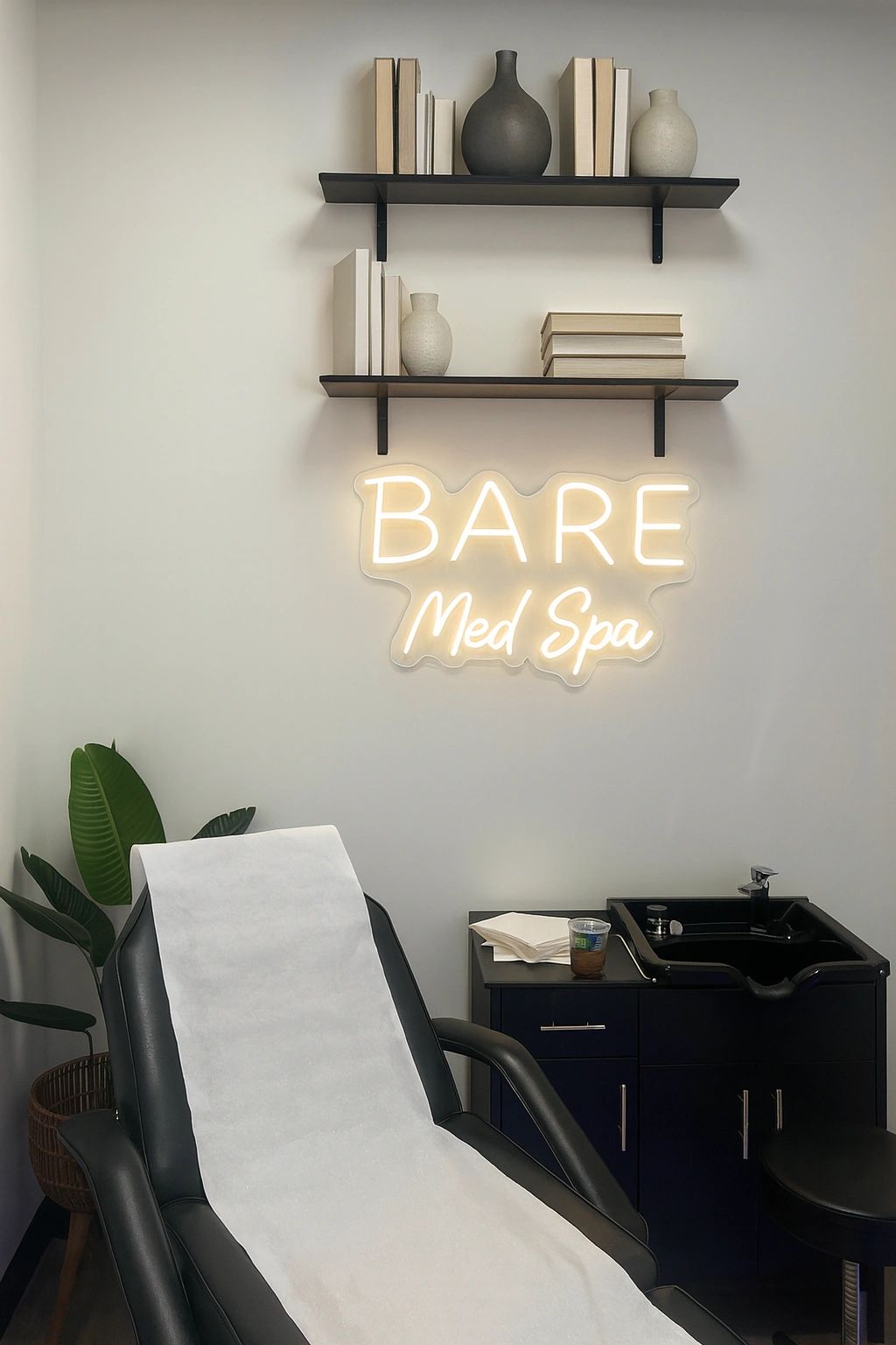 Clean, professional medical spa treatment room with neutral tones at Bare Medspa in Boca Raton