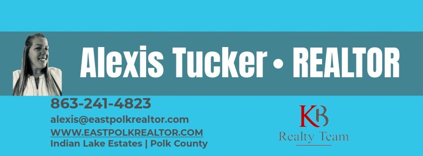 Stack of books next to pencils in a holder and a camera.