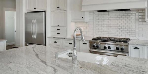 Island top with a beautiful apron sink. 