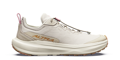 Cream-colored Altra running shoe with thick sole.