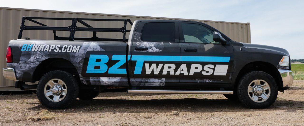 Side view of the BZT Wraps shop truck and its branded graphics