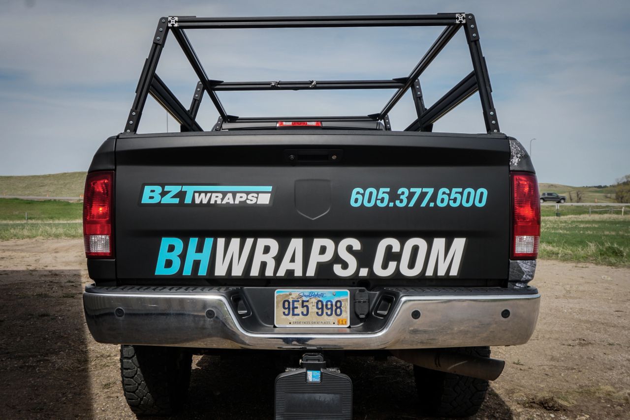 Rear view of the same BZT Wraps shop truck shown in the side-view photo