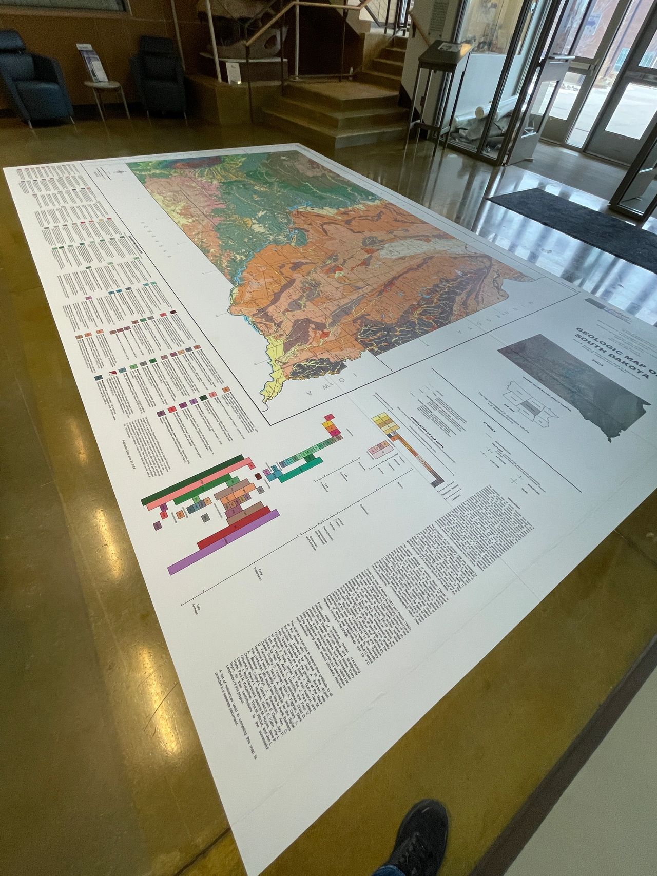 Interior floor displaying a large geological map graphic