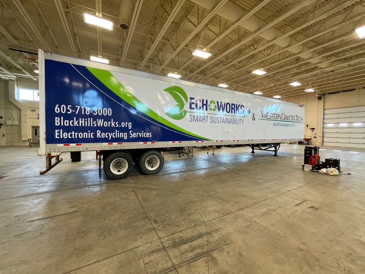Semi trailer displaying Black Hills Works and WDT electronic recycling graphics