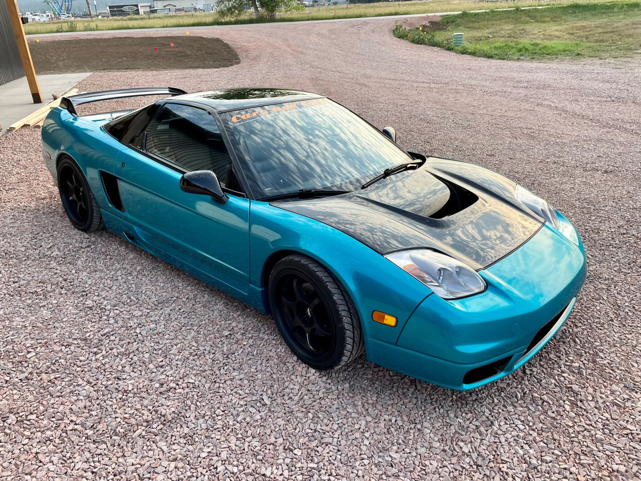 Sports car with a turquoise exterior finish