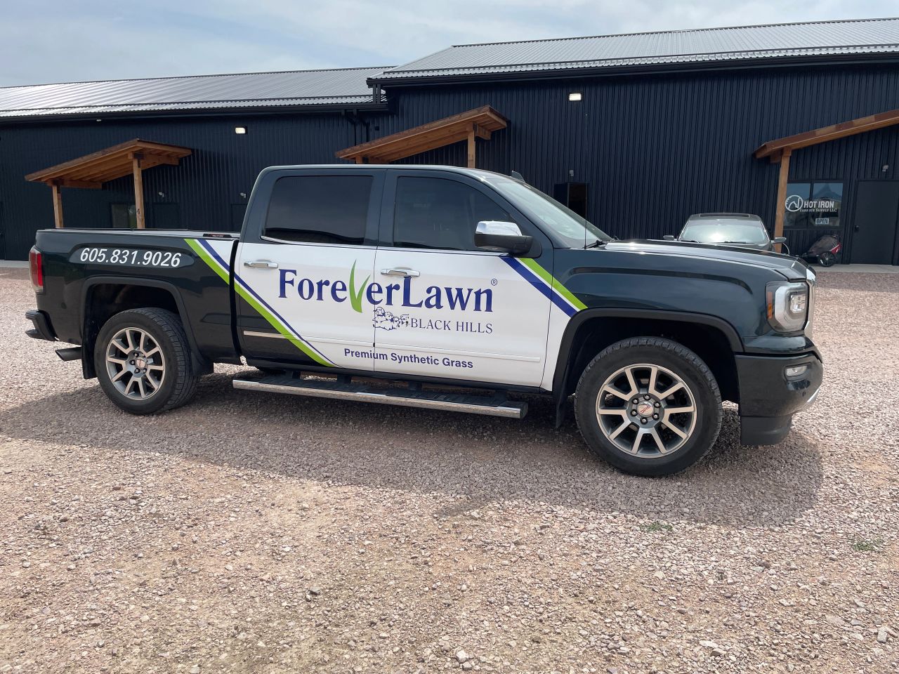 ForeverLawn Black Hills pickup displaying business graphics