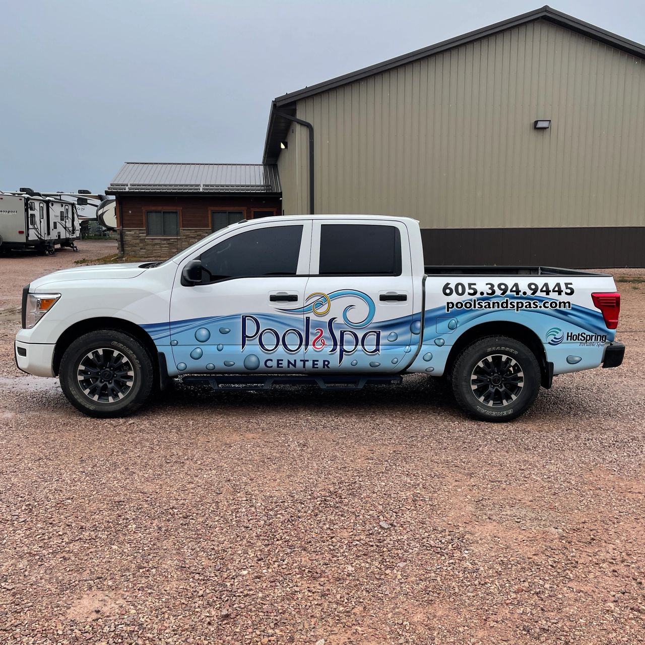 Pool & Spa Center pickup with branded vehicle graphics
