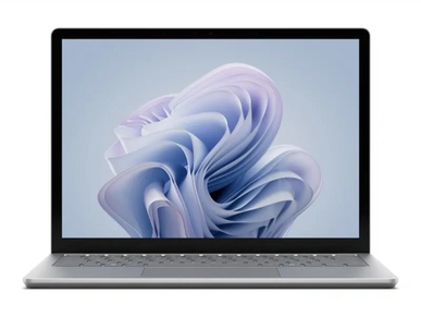 Sleek silver laptop with a modern abstract wallpaper on screen.