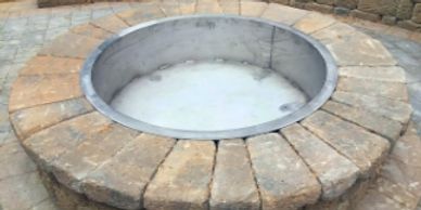 alt="fire pit bowl insert made from stainless steel with 2" flange and solid welded bowl."