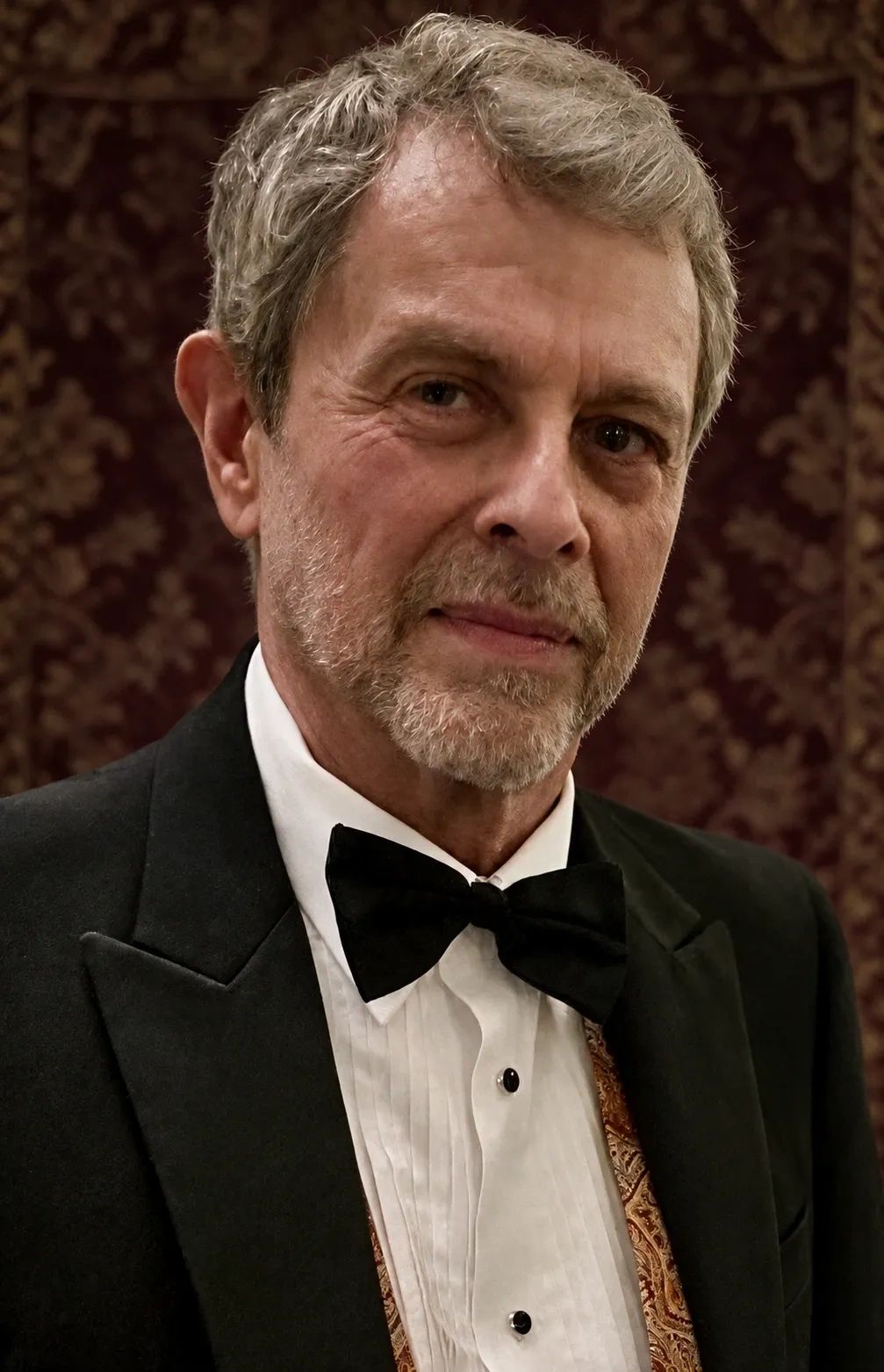 Portrait of a distinguished older man in formal attire.