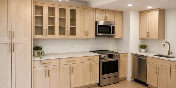 Kitchen renovation with custom cabinets made with solid maple hardwood and a natural finish. 