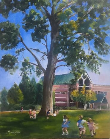 Children playing under a large tree near a school building on a sunny day.