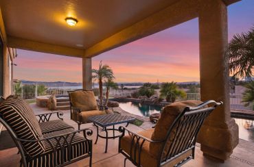 Relax and unwind on the cozy patio while enjoying breathtaking sunset views over Lake Havasu.