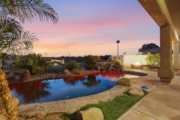 Poolside view with fire pit. 