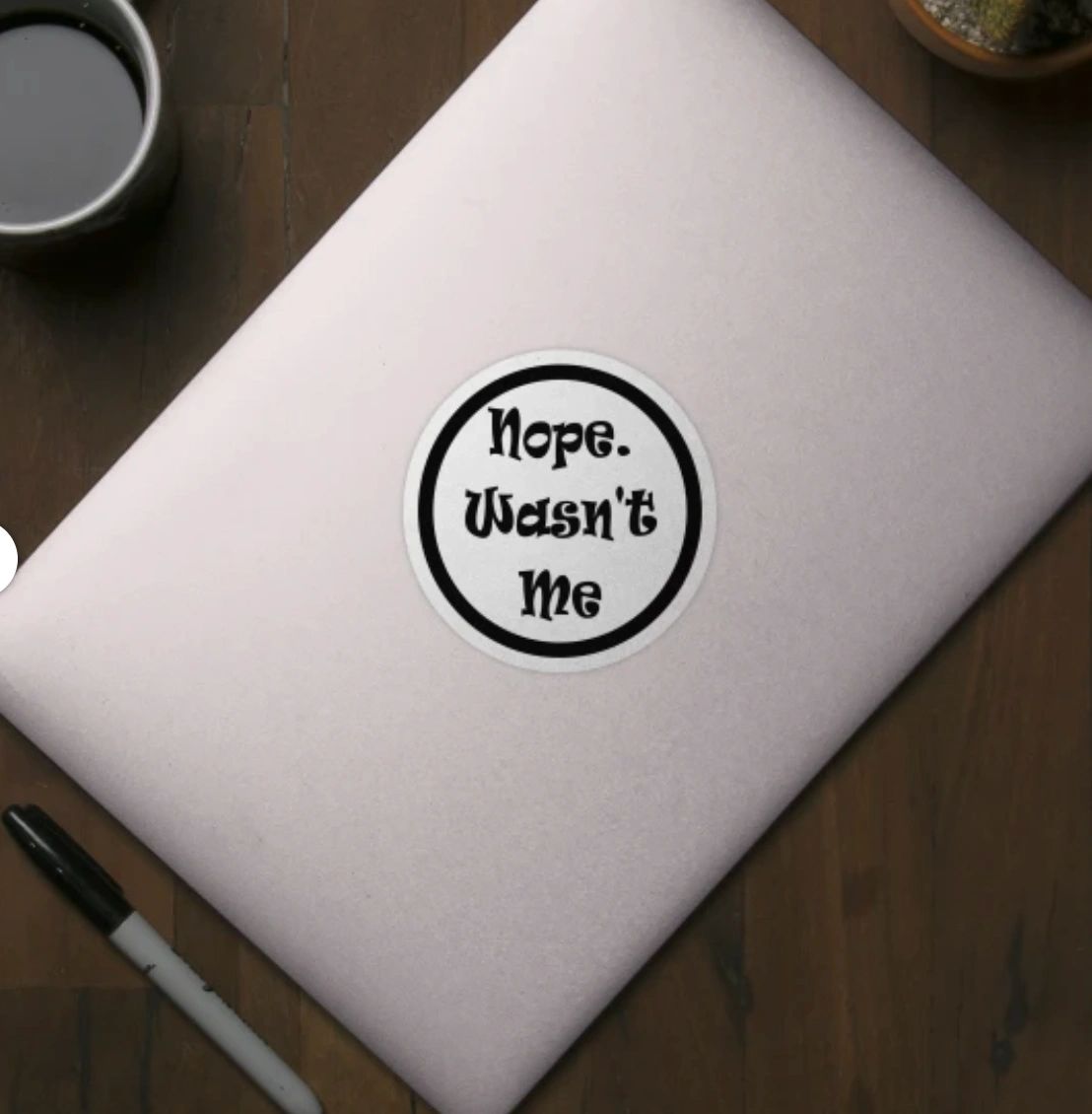 Laptop sticker reading: Nope. Wasn't Me