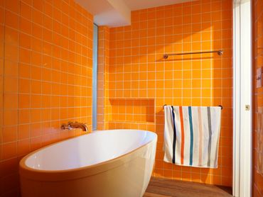 Colorful bathroom tile floor to ceiling