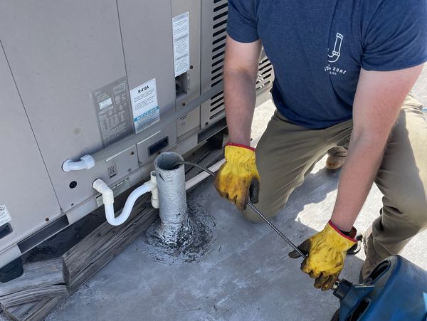 Clearing a clogged sewer line through the 3" roof vent access point