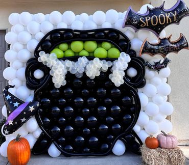 3D Balloon Wall. Halloween balloon decor. Purple balloons. Green balloons. Balloons near me 92618.