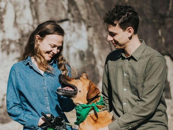 Kaitlin, Travis, and Eezo smiling.