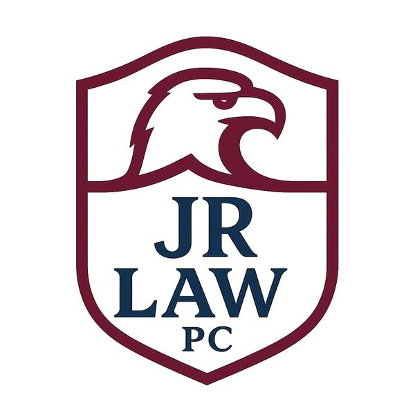 Logo of JR Law PC with an eagle head and shield design.