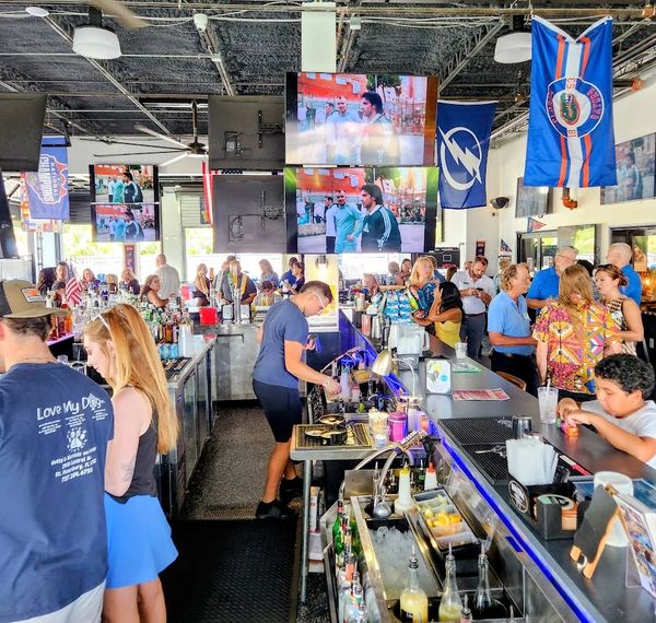 Guests at Mutts & Martinis dog-friendly sports bar in St. Petersburg