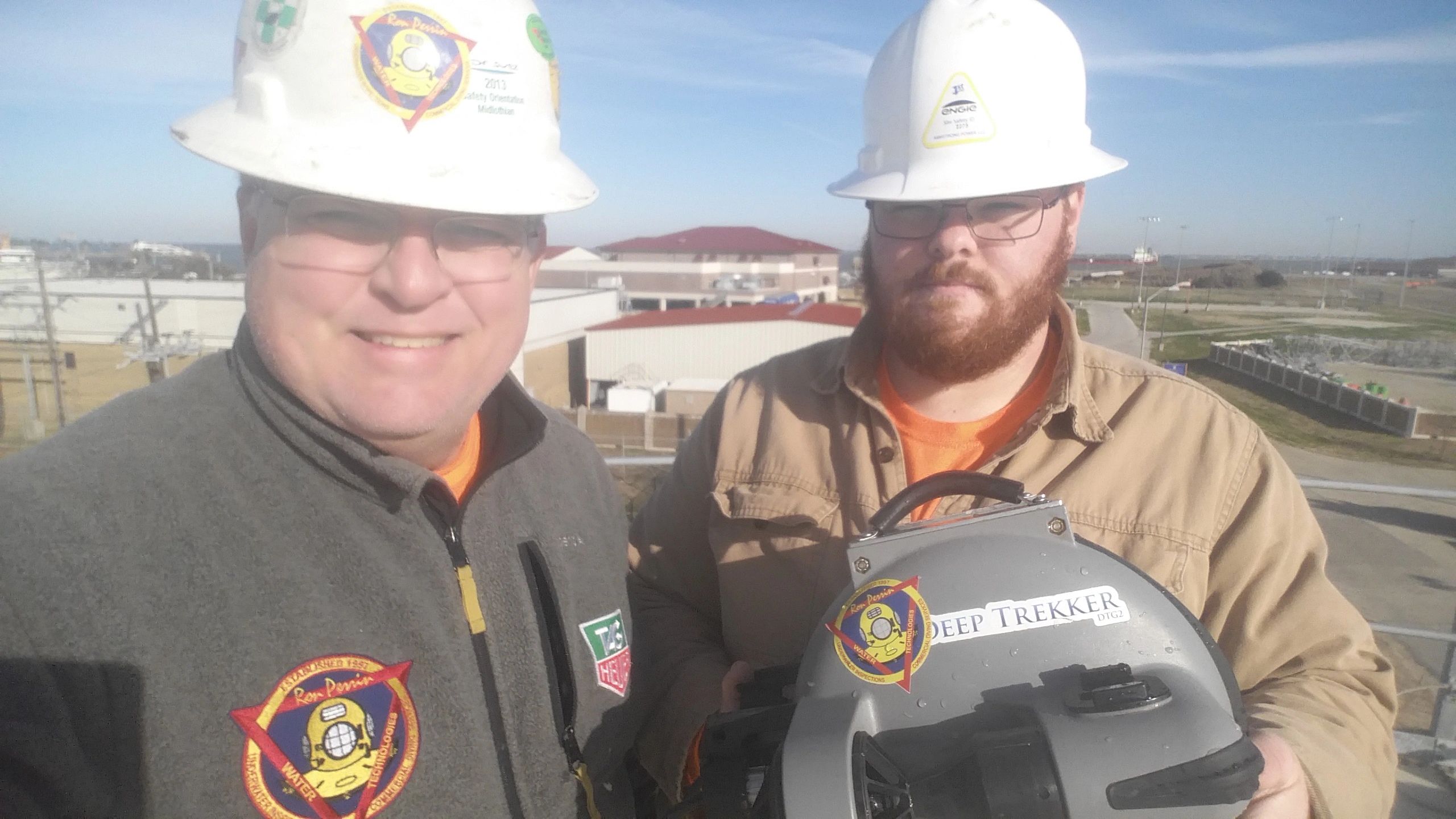 Ron and Robert Perrin holding a Deep Tracker ROV at the Coast Gaurd Station in Galveston, Texas. 