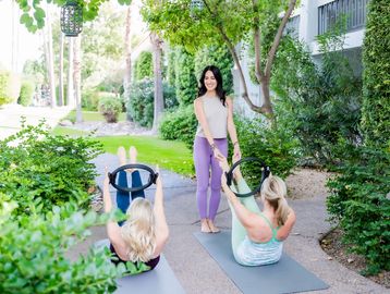 Rebecca teaches a semi-private Pilates session with the magic circle.