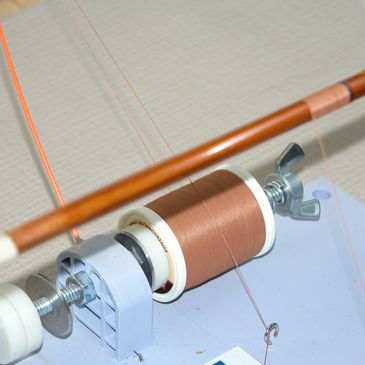 Copper wire spool and bobbin setup.